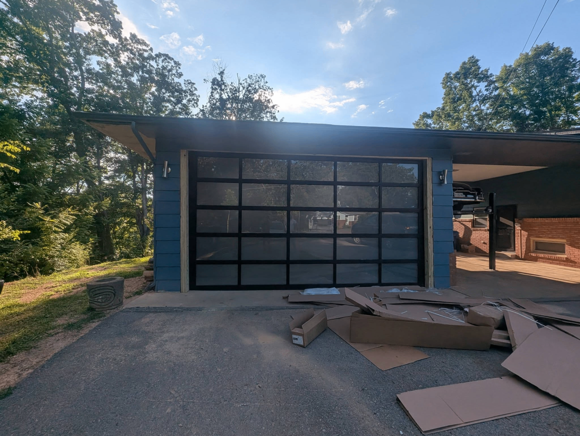 Modern full-view black aluminum & glass garage door installation