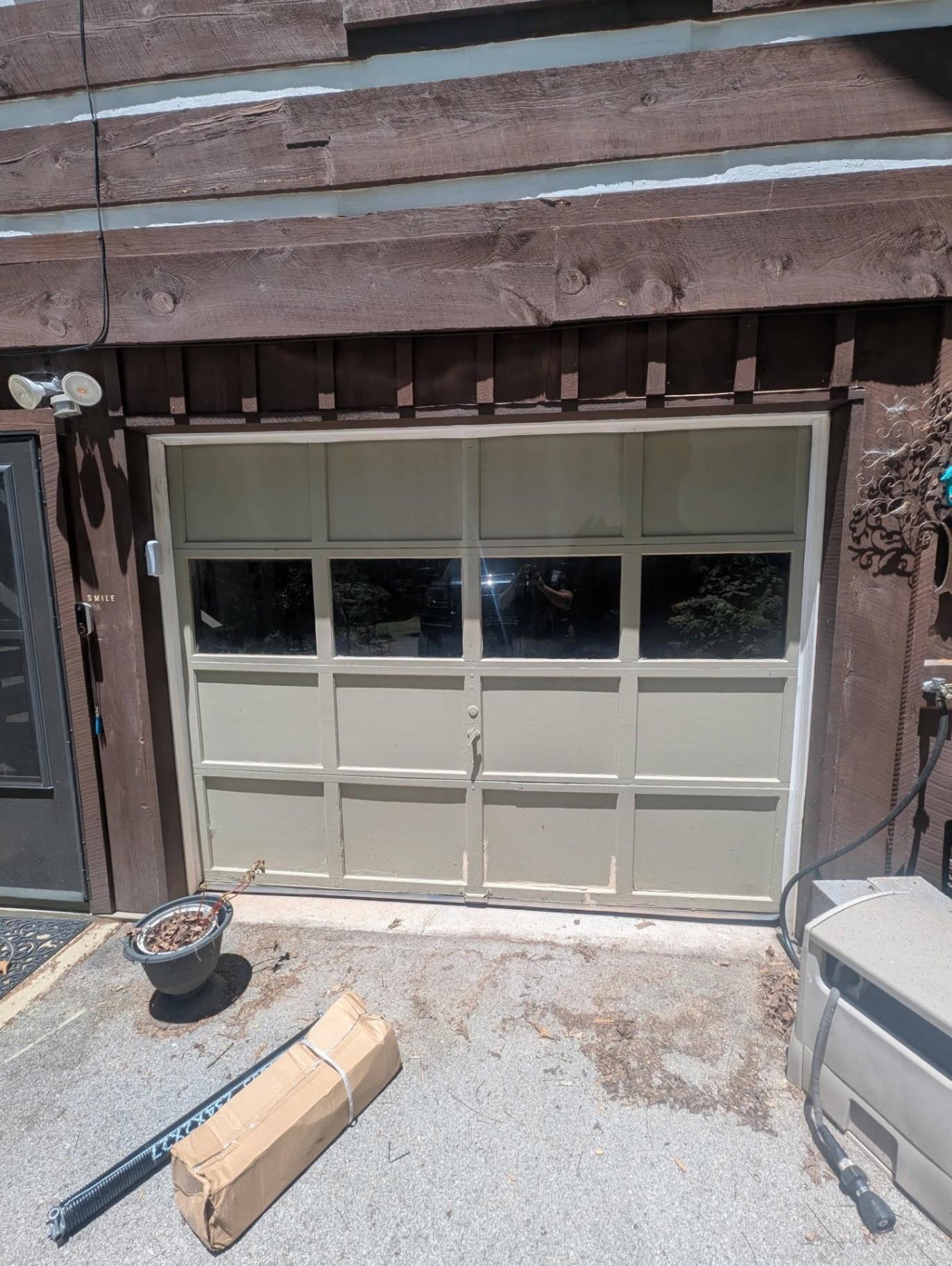 Vintage carriage-style garage door before replacement